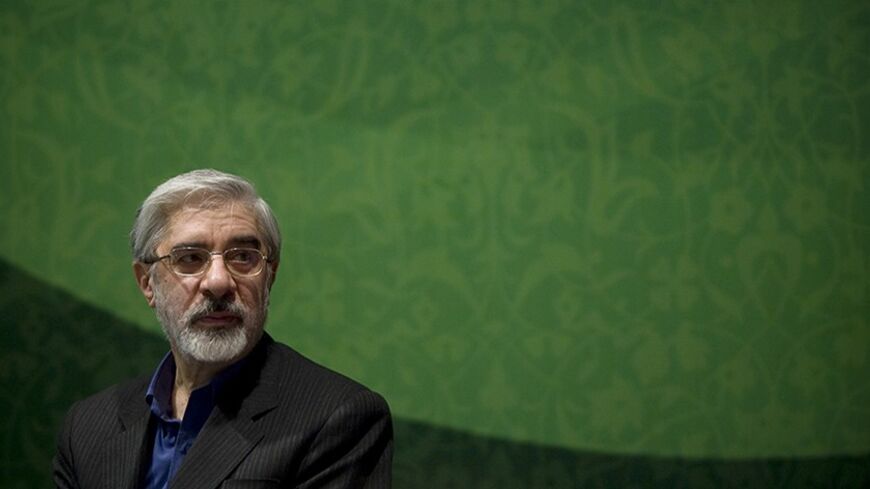 Former Prime Minister and Iran's upcoming presidential election candidate Mirhossein Mousavi looks on as he speaks to his supporters at an election campaign at a cultural centre in southern Tehran, May 30, 2009. REUTERS/Morteza Nikoubazl (IRAN POLITICS ELECTIONS) - RTR243BN
