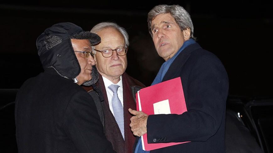 U.S. Secretary of State John Kerry (R) talks with Palestinian lead negotiator Saeb Erekat (L) and  State Department Mideast advisor Martin Indyk as he departs Joint Base Andrews in Washington enroute to Ukraine March 3, 2014.  In remarks today, U.S. President Barack Obama said Kerry will propose ways in which a negotiation between Russia and Ukraine could be overseen by a multilateral organization when he goes to Kiev on Tuesday.  REUTERS/Kevin Lamarque   (UNITED STATES - Tags: POLITICS) - RTR3G08L