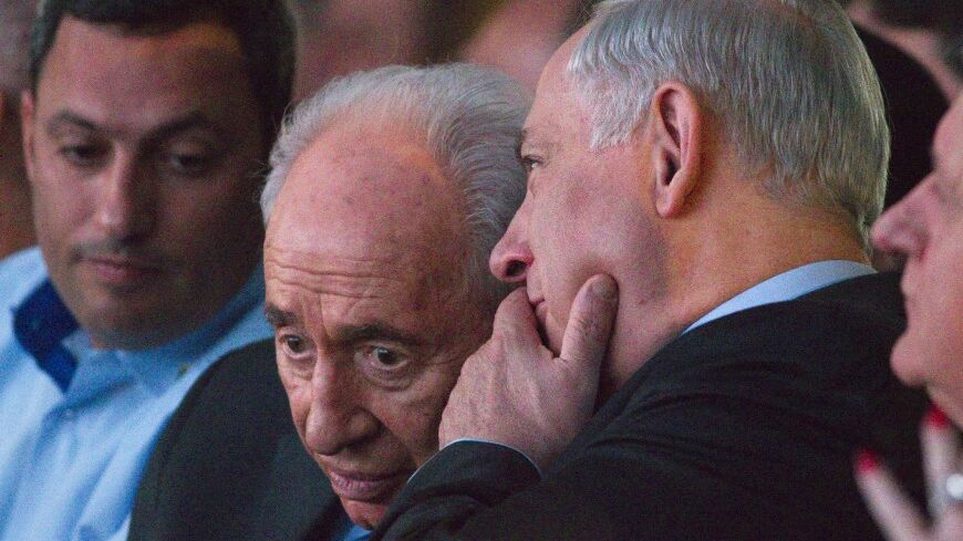 Israel's Prime Minister Benjamin Netanyahu speaks with President Shimon Peres (2nd L) at the sixth Negev Conference in the southern town of Sderot March 18, 2014. REUTERS/Amir Cohen (ISRAEL - Tags: POLITICS) - RTR3HJWJ