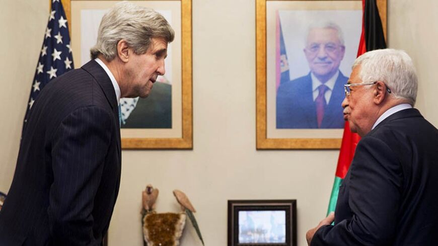 U.S. Secretary of State John Kerry (L), is greeted by  Palestinian leader Mahmoud Abbas, during their meeting at the Palestinian Ambassador?s Residence in Amman, Jordan  March 26, 2014. Kerry interrupted his Europe trip in an effort to salvage the Middle East peace talks as a breakdown looms.  REUTERS/Jacquelyn Martin/Pool   (JORDAN - Tags: POLITICS) - RTR3IPUV