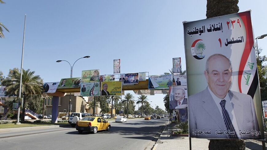 An election campaign poster of Iraq's former prime minister Ayad Allawi is pictured in Baghdad April 3, 2014. Iraq's parliamentary election is scheduled for later this month. REUTERS/Ahmed Saad (IRAQ - Tags: POLITICS ELECTIONS) - RTR3JUUI