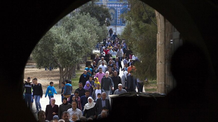 Palestinians leave the compound known to Muslims as Noble Sanctuary and to Jews as Temple Mount, after Friday prayers in Jerusalem's Old City April 4, 2014. U.S. Secretary of State John Kerry said on Friday Washington was evaluating whether to continue its role in Middle East peace talks, signalling his patience with the Israelis and Palestinians was running out. REUTERS/Amir Cohen (JERUSALEM - Tags: SOCIETY RELIGION) - RTR3JXYO