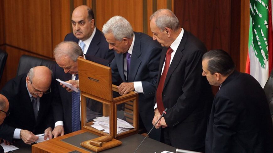 Lebanese members of parliament count the votes after casting their ballots to elect the new Lebanese president in the parliament building in downtown Beirut April 23, 2014. Lebanese parliamentarians failed to elect a new president in a first round of voting on Wednesday, with leading candidate Samir Geagea falling well short of the required two-thirds majority. REUTERS/Joseph Eid/Pool    (LEBANON - Tags: ELECTIONS POLITICS) - RTR3MATM