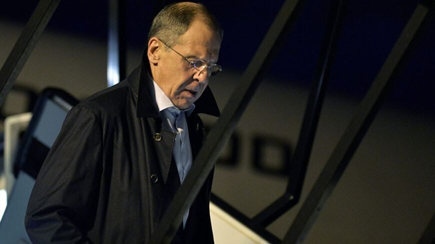 Russia's Foreign Minister Sergey Lavrov arrives at the airport in Geneva, to join talks over Iran's nuclear programme, November 22, 2013. Iran and six world powers struggled on Friday, after two days of talks, to overcome stumbling blocks to an interim deal under which Tehran would curb its contested nuclear programme in exchange for some relief from economic sanctions. REUTERS/Martial Trezzini/Pool (SWITZERLAND - Tags: POLITICS) - RTX15OXQ