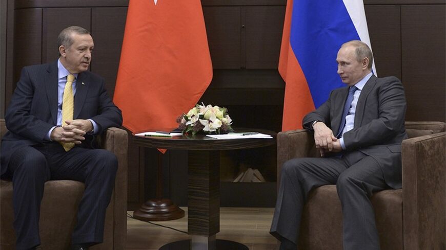 Russia's President Vladimir Putin (R) meets with Turkey's Prime Minister Tayyip Erdogan at the Bocharov Ruchei state residence in Sochi February 7, 2014. REUTERS/Alexei Nikolsky/RIA Novosti/Kremlin (RUSSIA  - Tags: POLITICS) ATTENTION EDITORS - THIS IMAGE HAS BEEN SUPPLIED BY A THIRD PARTY. IT IS DISTRIBUTED, EXACTLY AS RECEIVED BY REUTERS, AS A SERVICE TO CLIENTS - RTX18C9Z