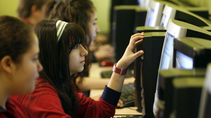 Children are seen in computer class at the Fatih College in Istanbul April 16, 2008. The 640-pupil school is run by followers of Fethullah Gulen, a Turkish Muslim preacher who advocates moderate Islam rooted in modern life, and whose teachings have inspired millions of Turks to forge a powerful socio-religious community active in publishing, charity and above all education. The Gulen movement has built up a network of some 800 schools around the world, teaching a full curriculum but with a strong focus on s