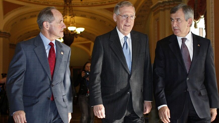 U.S. Senate Minority Leader Mitch McConnell (R-KY)(C) walks with newly elected Senators Jim Risch (R-ID)(L) and Mike Johanns (R-NE) on Capitol Hill in Washington, November 17, 2008.  REUTERS/Jim Young (UNITED STATES) - RTXAP29