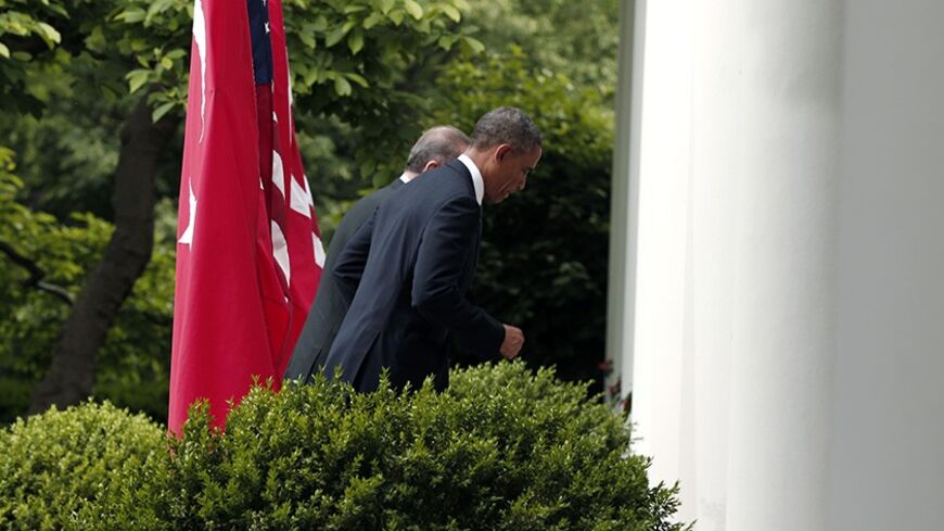 U.S. President Barack Obama (R) escorts Turkish Prime Minister Recep Tayyip Erdogan after a joint news conference in the White House Rose Garden in Washington, May 16, 2013.     REUTERS/Kevin Lamarque (UNITED STATES  - Tags: POLITICS)   - RTXZPJC