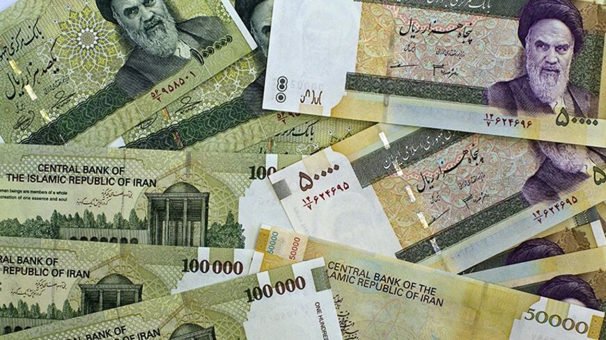 A picture taken on April 11, 2011 shows Iran's biggest dimonimation currencies, 100000 Rials (8.9 US dollars) and 50000 Rials (4.45 US dollars) in Tehran. Iran plans to slash four zeroes from the national currency in "one or two years", seeking parity between its rial and the US dollar, Central Bank Governor Mahmoud Bahmani has said. AFP PHOTO/BEHROUZ MEHRI (Photo credit should read BEHROUZ MEHRI/AFP/Getty Images)