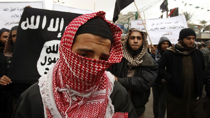 A Palestinian Salafist takes part in a protest against Syria's President Bashar al-Assad in Rafah in the southern Gaza Strip February 24, 2012. REUTERS/ Ibraheem Abu Mustafa (GAZA - Tags: POLITICS CIVIL UNREST) - RTR2YDFU