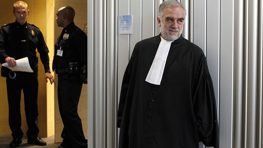 Outgoing International Criminal Court (ICC) prosecutor Luis Moreno-Ocampo (R) of Argentina leaves after the swearing-in ceremony to install Fatou Bensouda of Gambia as his successor at the International Criminal Court (ICC) in The Hague, Netherlands June 15, 2012.      REUTERS/Bas Czerwinski/Pool   (NETHERLANDS - Tags: CRIME LAW POLITICS) - RTR33ND1
