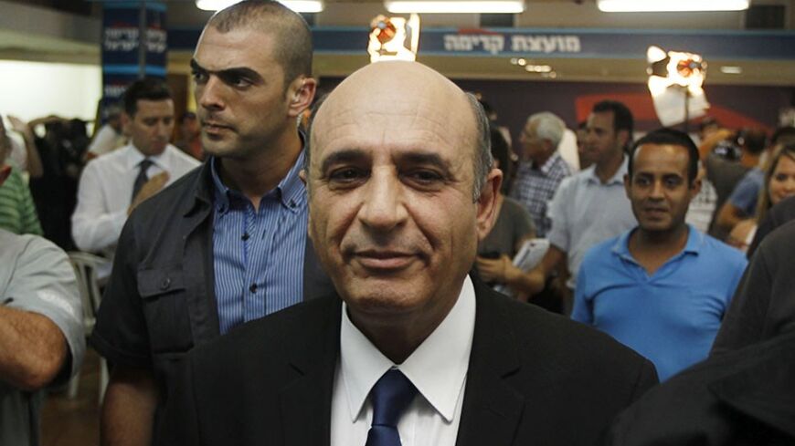 Kadima party leader Shaul Mofaz (C) leaves after convening a news conference in Petah Tikva, near Tel Aviv July 17, 2012. Israel's Kadima party quit Prime Minister Benjamin Netanyahu's coalition on Tuesday in a dispute over drafting ultra-Orthodox Jews into the military, but the government was not expected to collapse because it still had a majority in parliament. REUTERS/Baz Ratner (ISRAEL - Tags: POLITICS MILITARY RELIGION) - RTR350PV