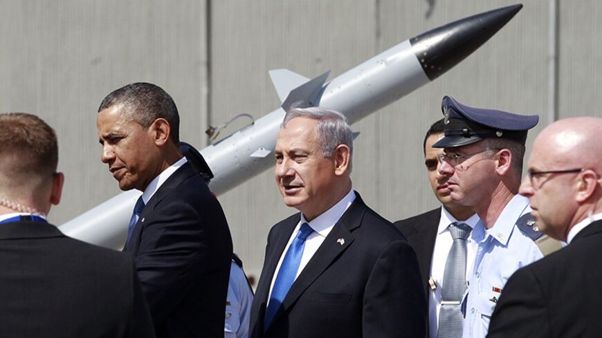 U.S. President Barack Obama and Israeli Prime Minister Benjamin Netanyahu (C) view an Iron Dome missile defense battery at Ben Gurion International Airport in Tel Aviv March 20, 2013. Obama said at the start of his first official visit to Israel on Wednesday that the U.S. commitment to the security of the Jewish state was rock solid and that peace must come to the Holy Land.  REUTERS/Jason Reed (ISRAEL - Tags: POLITICS MILITARY) - RTR3F821