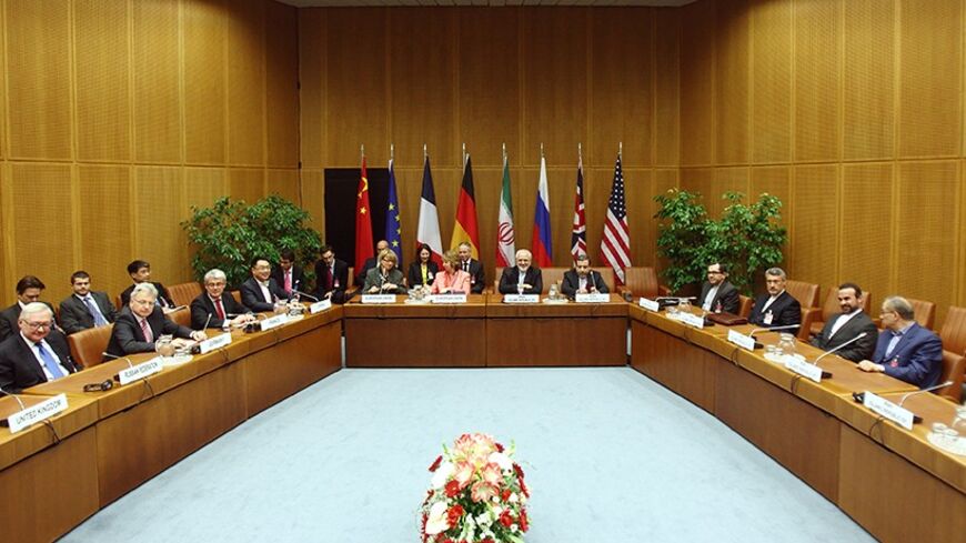 A general view of a meeting with European Union foreign policy chief Catherine Ashton (centre L) and Iranian Foreign Minister Mohammad Javad Zarif (centre R) in Vienna April 9, 2014. Six world powers and Iran will need "a lot of intensive work" to bridge differences during talks over Tehran's nuclear programme, Ashton said on Wednesday after their latest meeting. REUTERS/Heinz-Peter Bader  (AUSTRIA - Tags: POLITICS ENERGY) - RTR3KKPJ