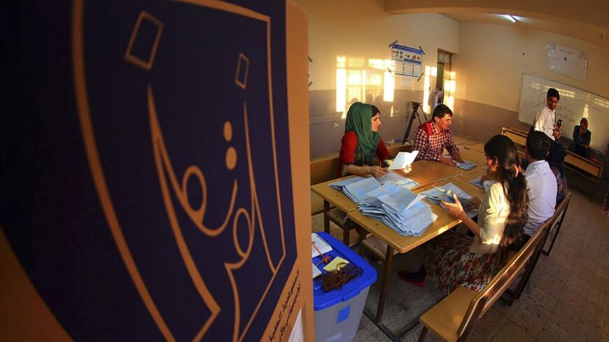 Employees of the Independent High Electoral Commission (IHEC) count ballots during Iraqi parliamentary elections in Arbil, capital of the autonomous Kurdistan region, about 350 km (217 miles) north of Baghdad April 30, 2014. Iraqis head to the polls on Wednesday in their first national election since U.S. forces withdrew from Iraq in 2011 as Prime Minister Nuri Maliki seeks a third term amid rising violence. REUTERS/Stringer  (IRAQ - Tags - Tags: ELECTIONS POLITICS) - RTR3NATN