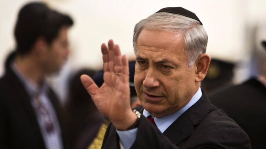 Israel's Prime Minister Benjamin Netanyahu gestures as he arrives for a ceremony marking Memorial Day in Jerusalem May 4, 2014. Israel commemorates its fallen soldiers on Memorial Day, which begins Sunday night. REUTERS/Nir Elias (JERUSALEM - Tags: ANNIVERSARY POLITICS CONFLICT) - RTR3NQKA