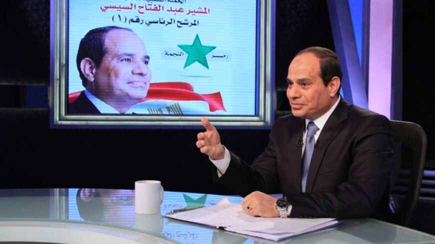 Presidential candidate and Egypt's former army chief Abdel Fattah al-Sisi talks during a television interview broadcast on CBC and ONTV, in Cairo,  May 6, 2014. Sisi, who is expected to win a presidential election this month, said in a television interview broadcast on Tuesday that costly energy subsidies could not be lifted quickly. REUTERS/Al Youm Al Saabi Newspaper (EGYPT - Tags: POLITICS ELECTIONS TPX IMAGES OF THE DAY) EGYPT OUT. NO COMMERCIAL OR EDITORIAL SALES IN EGYPT - RTR3OCAH