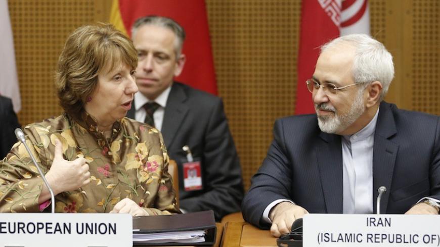 European Union foreign policy chief Catherine Ashton (L) and Iranian Foreign Minister Mohammad Javad Zarif wait for the start of talks in Vienna May 14, 2014. Six world powers and Iran launch the decisive phase of diplomacy over Tehran's nuclear work during three-day talks starting in Vienna on Wednesday, with the aim of resolving their decade-old dispute by July 20 despite skepticism a deal is possible. REUTERS/Leonhard Foeger  (AUSTRIA - Tags: POLITICS ENERGY) - RTR3P1Z8