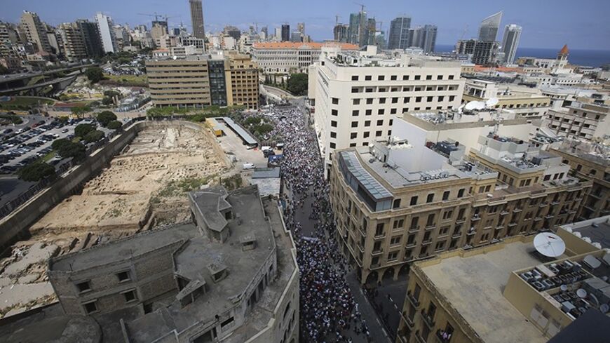 A general view shows protesters during a demonstration in front of the Grand Serail in Beirut, May 14, 2014.  Lebanese lawmakers say they hope to forge a deal on a public sector salary raise on Wednesday as the biggest in a series of protests by teachers and civil servants rallied outside parliament for what they called a "day of rage." REUTERS/Sharif Karim (LEBANON - Tags: POLITICS CIVIL UNREST BUSINESS EMPLOYMENT) - RTR3P2OG