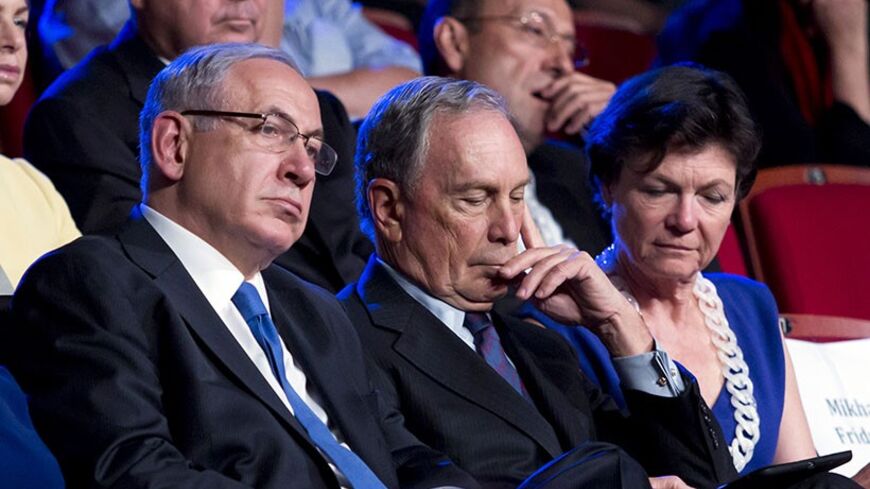 Israeli Prime Minister Benjamin Netanyahu (L) sits next to former New York City Mayor Michael Bloomberg (C) and his partner Diana Taylor during the Genesis Prize award ceremony in Jerusalem May 22, 2014. Bloomberg was the first-ever recipient of the $1 million prize on Thursday, which was organised by Israel's Prime Minister Office, the Genesis Philanthropy Group, and the Jewish Agency for Israel. Picture taken May 22, 2014. REUTERS/Jim Hollander/Pool (JERUSALEM - Tags: POLITICS) - RTR3QHH0