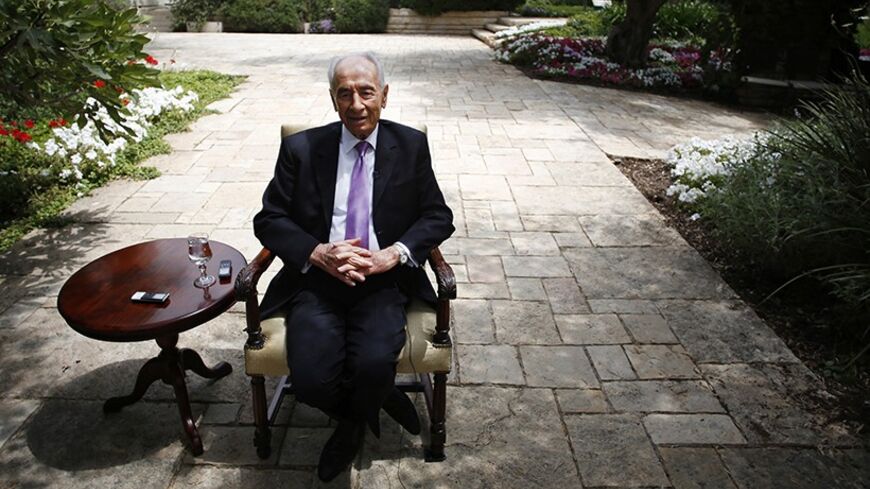 Israel's President Shimon Peres speaks during an interview with Reuters at his residence in Jerusalem June 16, 2013. In a wide-ranging interview with Reuters before his 90th birthday, Peres dismissed the idea that Israel could launch a unilateral military strike against Iran's nuclear facilities and urged Palestinians and Israelis to forge immediate peace. Picture taken June 16, 2013. To match Interview ISRAEL-PERES/  REUTERS/Baz Ratner (JERUSALEM - Tags: POLITICS) - RTX10RK7