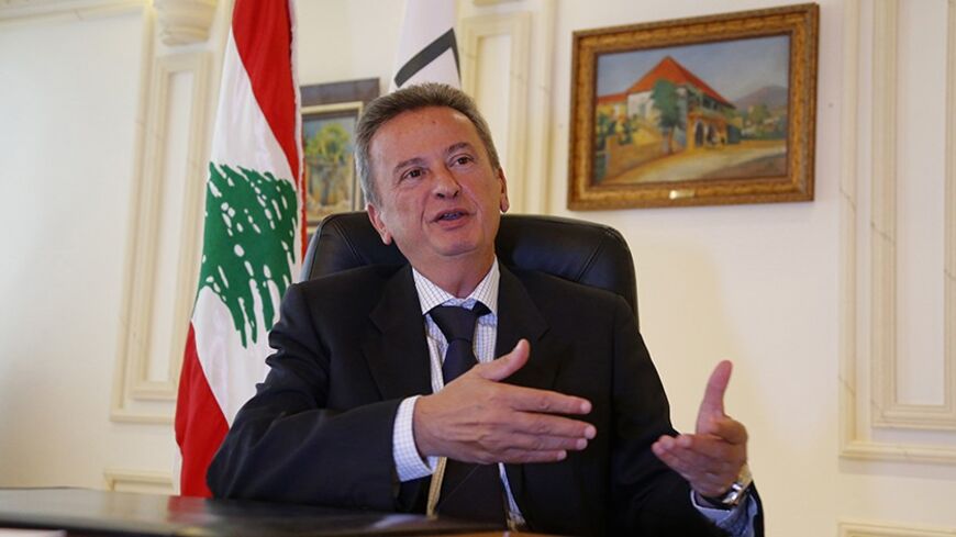 Lebanon's Central Bank governor Riad Salameh gestures as he attends an interview with Reuters at the Lebanese Central Bank in Beirut September 16, 2013. Salameh said the stimulus plan had been vital to keeping Lebanon's economy growing at a rate which he estimated at between 2.0 and 2.25 percent this year, and additional support would be needed in 2014.  REUTERS/Mohamed Azakir (LEBANON - Tags: BUSINESS) - RTX13NQT