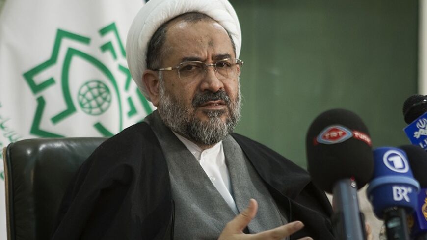 EDITORS' NOTE: Reuters and other foreign media are subject to Iranian restrictions on their ability to film or take pictures in Tehran.

Iran's Intelligence Minister Heydar Moslehi speaks with foreign and local media at a news conference in Tehran January 11, 2011. Iran warned neighbouring countries not to help its arch-foe Israel, one day after announcing it had rounded up a spy ring linked to Israel which it said had assassinated an Iranian nuclear scientist. REUTERS/Morteza Nikoubazl (IRAN - Tags: CRIME 