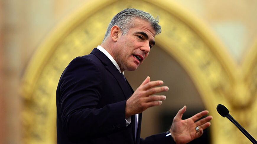 Israel's Financial Minister Yair Lapid adresses the conference of "Jewish life and anti-semitism in contemporary Europe"  in the Upper House of the parliament building on October 1, 2013 in Budapest, Hungary.  The two-day conference was organized by the Tom Lantos Institute (TLI)  and supported by the Hungarian Ministry of Foreign Affairs and addresses relevant issues and concerns of European Jewish communities today. AFP PHOTO / ATTILA KISBENEDEK