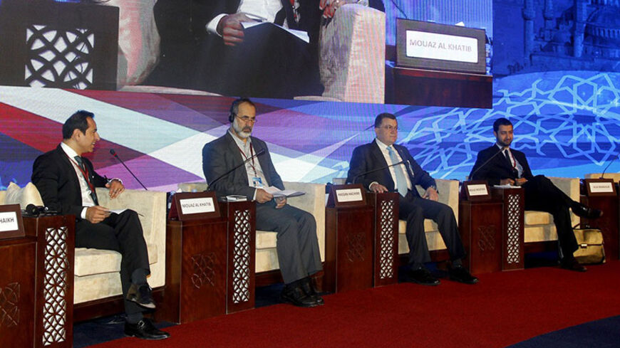 From left to right:- Alia Mansour, member of the Syrian National Coalition, Mouaz al-Khatib, Former President of the National Coalition for Syrian Revolutionary and Opposition Forces, and Hassan Hachimi, member of the Syrian National Coalition, attend the U.S. Islamic World Forum, in Doha, on June 10, 2014. This years Forum is entitled Islam and Inclusion focuses on challenges of inclusion within Muslim communities around the world, especially in the context of governance, academia, religious institutions a