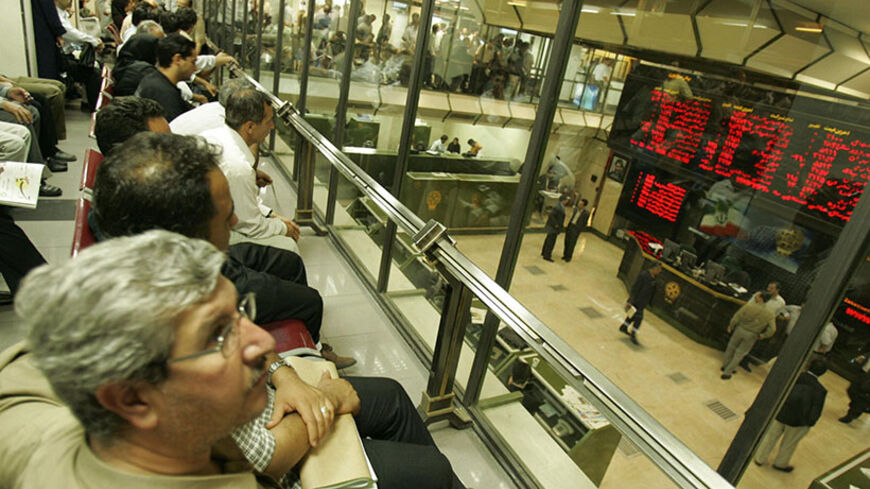 TEHRAN, IRAN:  A partial view shows Tehran Stock Market 26 June 2005. Iran's president-elect Mahmood Ahmadinejad intends to offer Iranians free shares in state-owned enterprises and slash interest rates for corporate investment, a close aide said. The aide also played down the importance of fluctuating price movements on the Iranian bourse, where investors have been jittered by the lack of a concrete economic plan offered by Ahmadinejad. AFP PHOTO/PATRICK BAZ  (Photo credit should read PATRICK BAZ/AFP/Getty