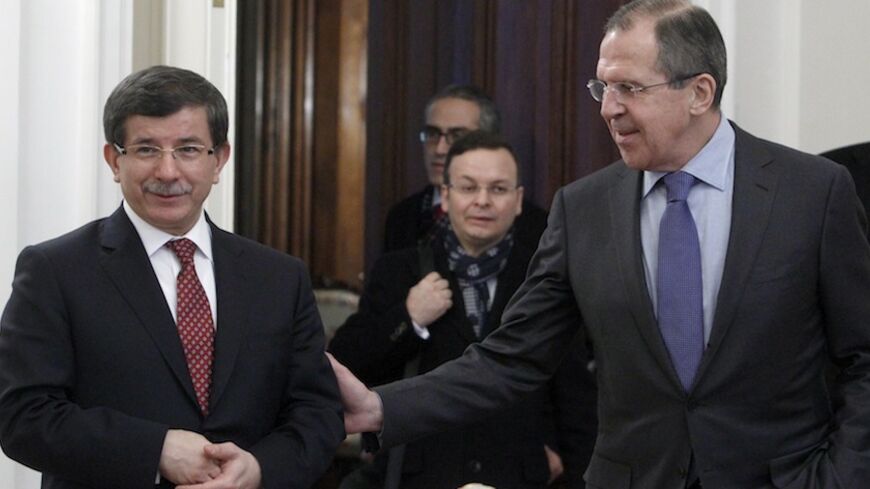 Russia's Foreign Minister Sergei Lavrov (R) talks with his Turkish counterpart Ahmet Davutoglu during their meeting in Moscow January 25, 2012. REUTERS/Sergei Karpukhin (RUSSIA - Tags: POLITICS) - RTR2WTHM
