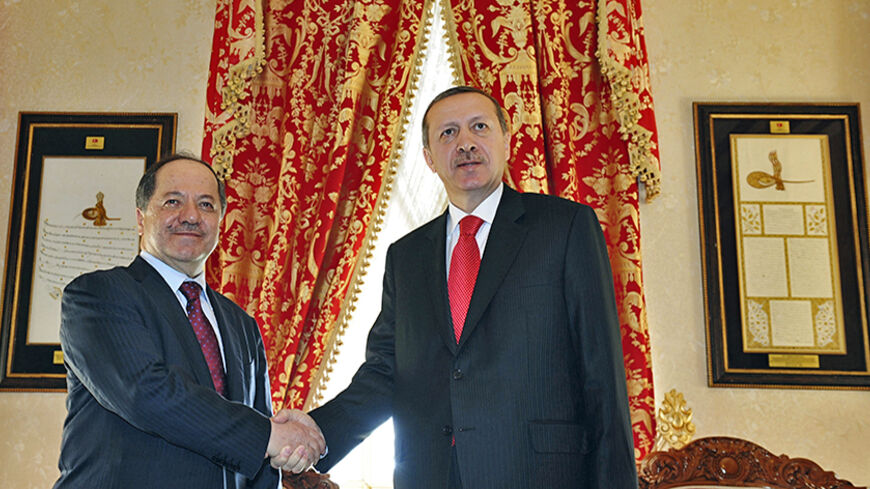 Turkish Prime Minister Tayyip Erdogan (R) and Kurdistan Region President Masoud Barzani shake hands before their meeting in Istanbul April 19, 2012. REUTERS/Stringer/Pool (TURKEY - Tags: POLITICS) - RTR30XVH