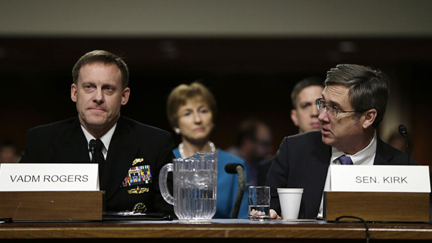 U.S. Navy Vice Admiral Michael Rogers (L) and Senator Mark Kirk (R-IL) (R) appear at the Senate Armed Services Committee confirmation hearing on Capitol Hill in Washington March 11, 2014. The hearing is for Rogers' nomination to be director of the National Security Agency (NSA) and commander of the U.S. Cyber Command. Rogers and Kirk were high school classmates in Chicago.  REUTERS/Gary Cameron  (UNITED STATES - Tags: MILITARY POLITICS) - RTR3GLRD