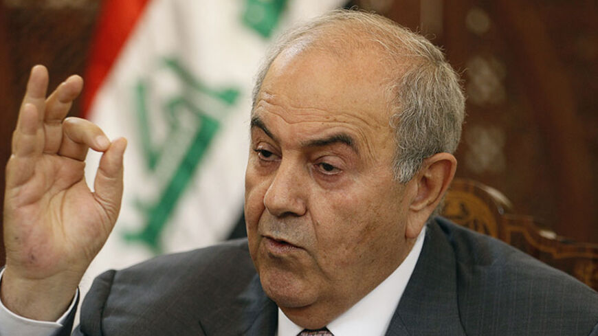 Former Iraqi Prime Minister Ayad Allawi speaks during an interview with Reuters in Baghdad, April 20, 2014. For Prime Minister Nouri al Maliki, a politician who saw himself as the one who rescued Iraq from civil war in the last decade, the current state of affairs amounts to a stunning reversal of fortune as Islamic State of Iraq and the Levant (ISIL) fighters inch towards the capital and Shiite militias he vanquished assert their influence again. Picture taken April 20, 2014. REUTERS/Thaier al-Sudani (IRAQ
