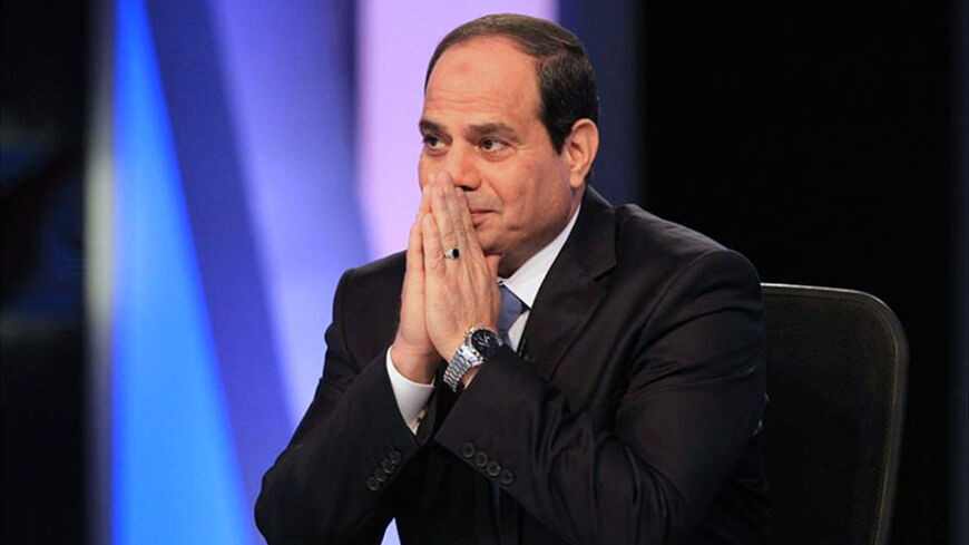 Presidential candidate and Egypt's former army chief Abdel Fattah al-Sisi talks during a television interview broadcast on CBC and ONTV, in Cairo,  May 6, 2014. Sisi, who is expected to win a presidential election this month, said in a television interview broadcast on Tuesday that costly energy subsidies could not be lifted quickly. REUTERS/Al Youm Al Saabi Newspaper (EGYPT - Tags: POLITICS ELECTIONS) EGYPT OUT. NO COMMERCIAL OR EDITORIAL SALES IN EGYPT - RTR3OCB5