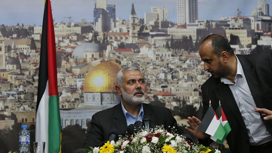 Senior Hamas leader Ismail Haniyeh prepares to deliver a farewell speech for his former position as a Hamas government Prime Minister, in Gaza City June 2, 2014. Palestinian President Mahmoud Abbas swore in a unity government on Monday after overcoming a last-minute dispute with the Hamas Islamist group. REUTERS/Suhaib Salem  (GAZA - Tags: POLITICS) - RTR3RTNG