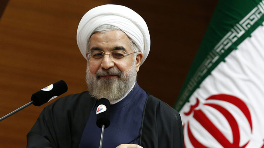 Iran's President Hassan Rouhani addresses the audience during a meeting in Ankara June 10, 2014. REUTERS/Umit Bektas (TURKEY - Tags: POLITICS) - RTR3T16B
