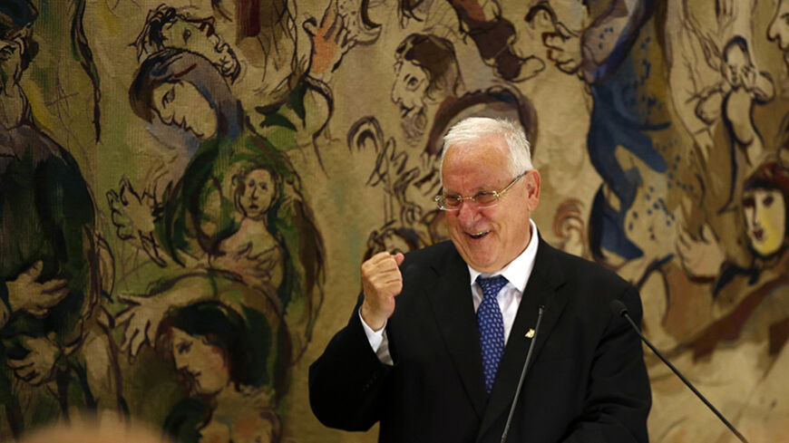 Reuven Rivlin, a former speaker of parliament, gestures during his speech after he was elected Israel's president at the Knesset, Israel's parliament, in Jerusalem June 10, 2014. Rivlin, a right-wing legislator opposed to the creation of a Palestinian state, was elected Israel's president on Tuesday and will replace the dovish Shimon Peres in the largely ceremonial post. REUTERS/Ronen Zvulun (JERUSALEM - Tags: POLITICS ELECTIONS PROFILE) - RTR3T26Q