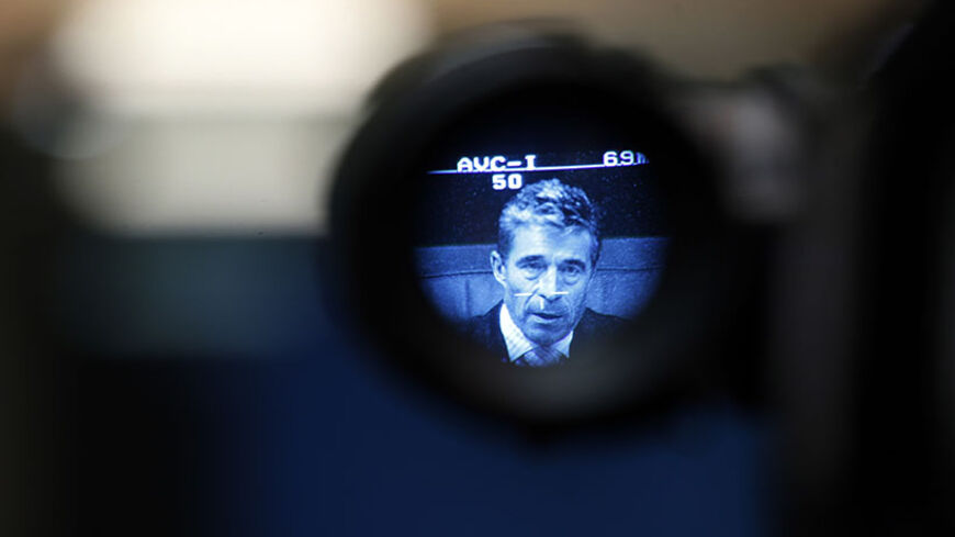 NATO Secretary General Anders Fogh Rasmussen, is seen through a viewfinder, as he addresses the media during a joint news conference with Spanish Foreign Minister Jose Manuel Garcia-Margallo (not pictured) in Madrid June 12, 2014. REUTERS/Susana Vera (SPAIN - Tags: POLITICS) - RTR3TEGG