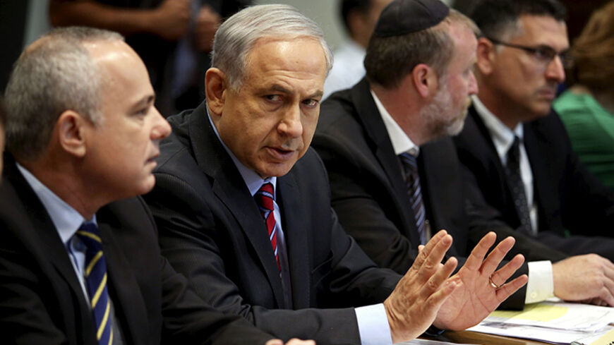 Israel's Prime Minister Benjamin Netanyahu (2nd L) attends the weekly cabinet meeting in Tel Aviv June 15, 2014. Netanyahu on Sunday blamed Palestinian militants from the Hamas Islamist group for the abduction of three Israeli teenagers in the occupied West Bank, Army Radio reported. REUTERS/Abir Sultan/Pool (ISRAEL - Tags: POLITICS) - RTR3TUX1