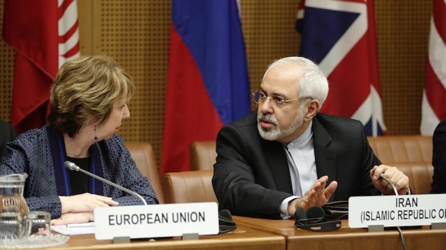 European Union Foreign Policy Chief Catherine Ashton (L) and Iranian Foreign Minister Mohammad Javad Zarif wait for the begin of talks in Vienna June 17, 2014. Six world powers and Iran began their fifth round of nuclear negotiations on Tuesday in hopes of salvaging prospects for a deal over Tehran's disputed atomic activity by a July deadline.  REUTERS/Heinz-Peter Bader (AUSTRIA - Tags: POLITICS ENERGY) - RTR3U83T