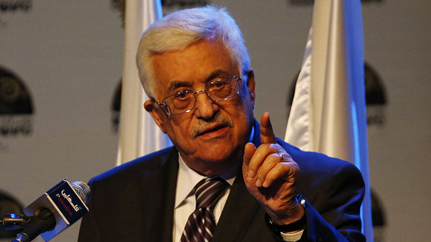 Palestinian President Mahmoud Abbas gestures as he speaks during a conference in the West Bank city of Ramallah June 19, 2014.  Israeli forces traded gunfire with Palestinians on Thursday, the military said, in the fiercest street battles in the occupied West Bank since a search began for three Israeli teenagers missing for a week. Abbas roundly condemned the kidnappers on Wednesday and promised to hold to account those responsible. His words in turn were denounced by Hamas and other factions, who accused h