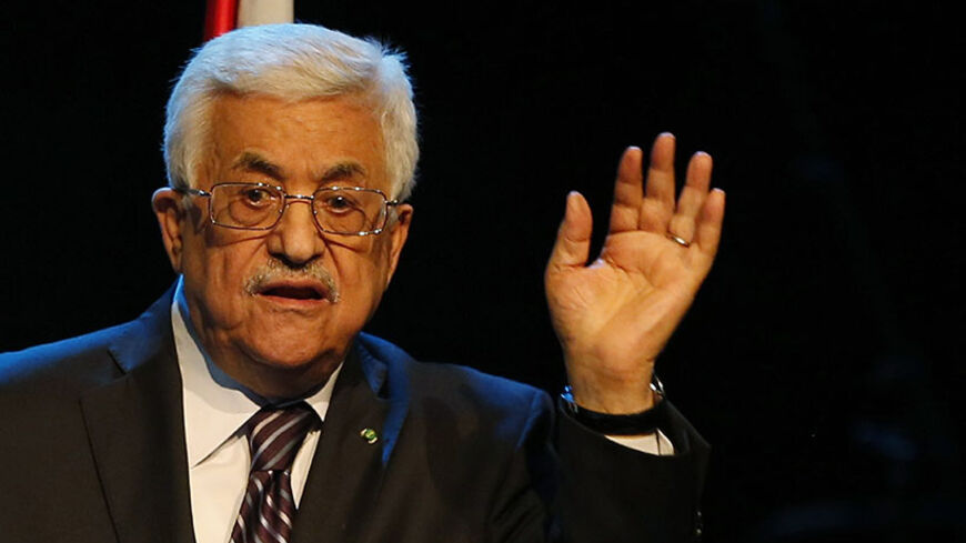 Palestinian President Mahmoud Abbas gestures as he speaks during a conference in the West Bank city of Ramallah June 19, 2014. Israeli forces traded gunfire with Palestinians on Thursday, the military said, in the fiercest street battles in the occupied West Bank since a search began for three Israeli teenagers missing for a week. Abbas roundly condemned the kidnappers on Wednesday and promised to hold to account those responsible. His words in turn were denounced by Hamas and other factions, who accused hi