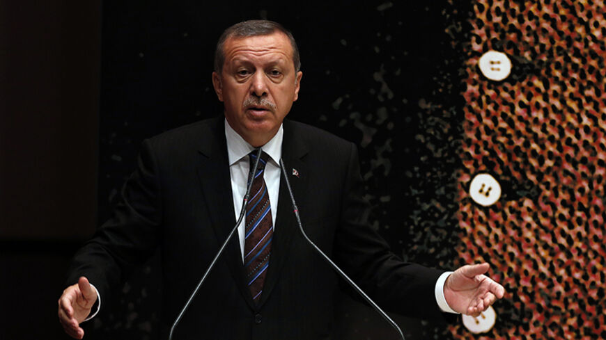 Turkey's Prime Minister Tayyip Erdogan addresses the audience at a meeting at his ruling Ak Party (AKP) headquarters in Ankara June 25, 2014. REUTERS/Umit Bektas (TURKEY - Tags: POLITICS) - RTR3VNAY