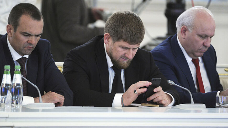 Chechen leader Ramzan Kadyrov (C) attends a session of the State Council at the Kremlin in Moscow May 31, 2013.  REUTERS/Michael Klimentyev/RIA Novosti/Kremlin (RUSSIA  - Tags: POLITICS) ATTENTION EDITORS - THIS IMAGE HAS BEEN SUPPLIED BY A THIRD PARTY. IT IS DISTRIBUTED, EXACTLY AS RECEIVED BY REUTERS, AS A SERVICE TO CLIENTS - RTX107AJ