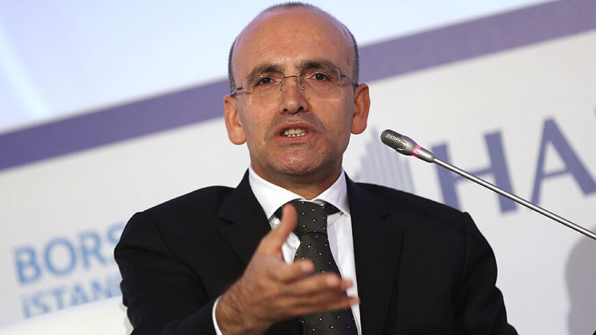 Turkey's Finance Minister Mehmet Simsek speaks during the 4th Istanbul Finance Summit in Istanbul September 19, 2013. Turkey will get only brief relief from the surprise postponement of a reduction in U.S. economic stimulus and must press ahead with plans to rebalance its own economy, Simsek said on Thursday. To match Interview TURKEY-ECONOMY/ REUTERS/Murad Sezer (TURKEY - Tags: POLITICS BUSINESS) - RTX13R39