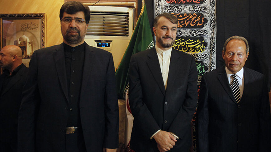 (From L-R) Iran's ambassador to Lebanon Ghazanfar Roknabadi, Iran's Deputy Foreign Minister Hossein Amir-Abdollahian and former Lebanese President Emile Lahoud receive condolences at the Iranian embassy for Iranian cultural attache to Lebanon, Ebrahim Ansari, who was killed during the two suicide bombings that occurred on Tuesday, in Beirut November 20, 2013. Two suicide bombings rocked Iran's embassy compound in Lebanon on Tuesday, killing at least 23 people including an Iranian cultural attache and hurlin