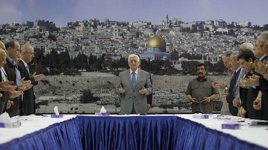 Palestinian president Mahmud Abbas (C) prays prior a meeting with his leadership in the West Bank city of Ramallah on July 9, 2014. Abbas has demanded Israel "immediately stop" its air campaign on the Gaza Strip and called on the international community to pressure the Jewish state. Israeli warplanes pounded targets in the Gaza Strip today as a major campaign to stop volleys of Palestinian rocket fire entered its second day. AFP PHOTO / ABBAS MOMANI        (Photo credit should read ABBAS MOMANI/AFP/Getty Im