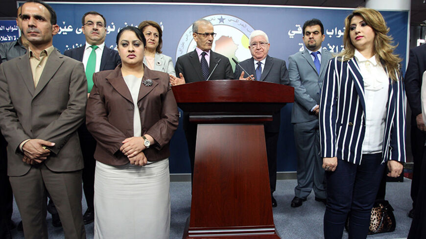 Fuad Masum (C-R), the new president of Iraq and a veteran Kurdish politician, stands with Kirkuk provincial Governor Najm al-Din Karim (C-L) during a press conference in Baghdad on July 24, 2014, after Fuad was elected by an overwhelming majority in the Parliament. Masum succeeds the ailing Jalal Talabani, who returned only five days ago from 18 months of medical treatment in Germany to serve out his tenure. AFP PHOTO / ALI AL-SAADI        (Photo credit should read ALI AL-SAADI/AFP/Getty Images)