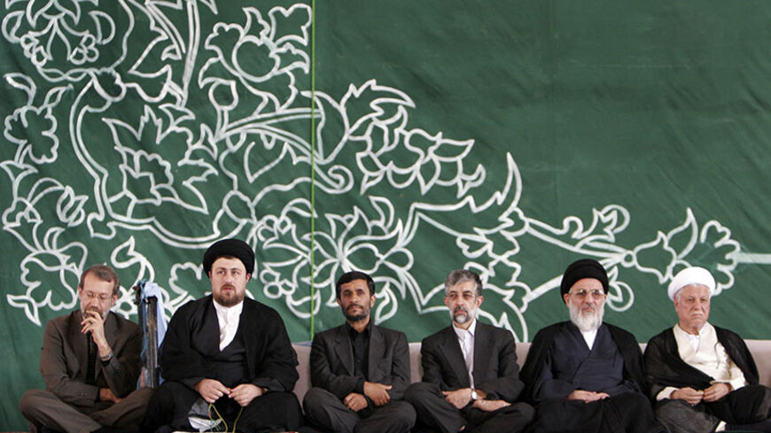 Senior Iranian Officials (L to R) Chief nuclear negotiator Ali Larijani, Hasan Khomeini, President Mahmoud Ahmadinejad, parliament Speaker Gholamali Haddadadel, Judiciary chief Mahmoud Hashemi Shahroudi and former President Akbar Hashemi Rafsanjani listen to a speech by Supreme Leader Ayatollah Ali Khamenei during the anniversary of the death of the Late Leader Ayatollah Ruhollah Khomeini, Tehran,  June 4, 2006.    REUTERS/Raheb Homavandi    (IRAN) - RTR1E2OI